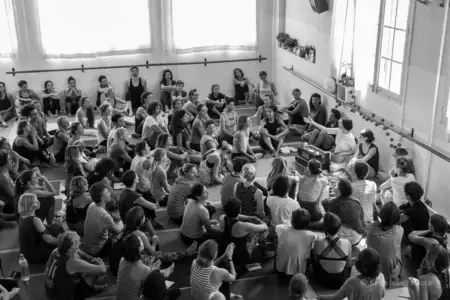 A community gathering in the practice space